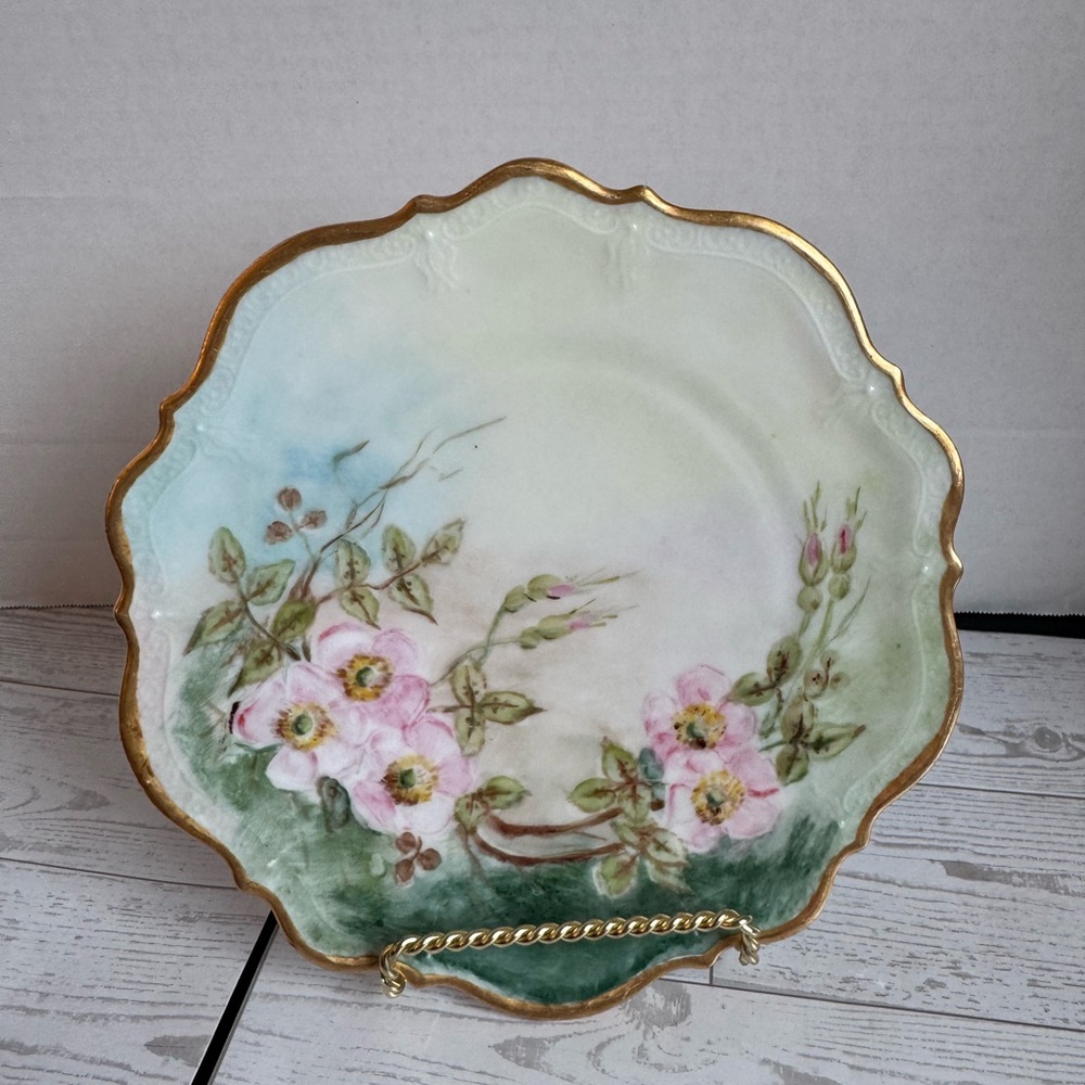 Hand-Decorated Porcelain Dinner Plate with Pink Floral Motif and Gold Trim.
